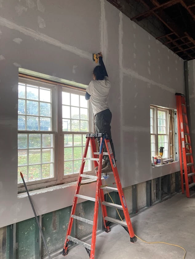 Sanding the Classroom Walls