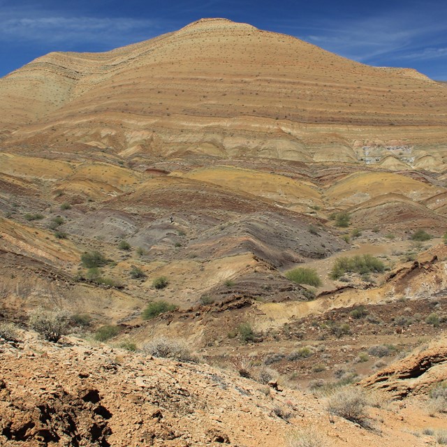 Desert hillside with exposed rock layers — the Grand Canyon Supergroup