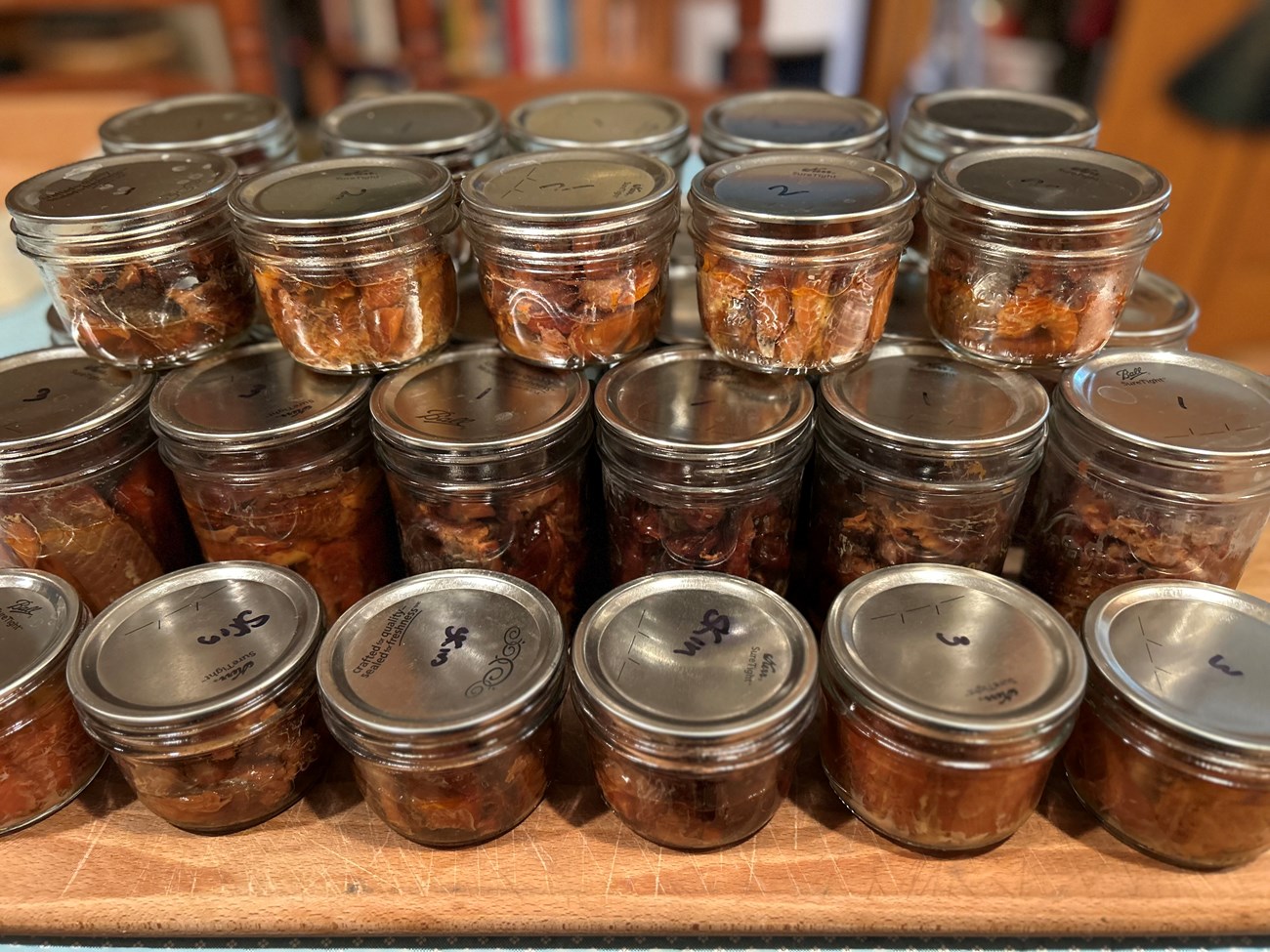 Small sealed glass jars of canned salmon
