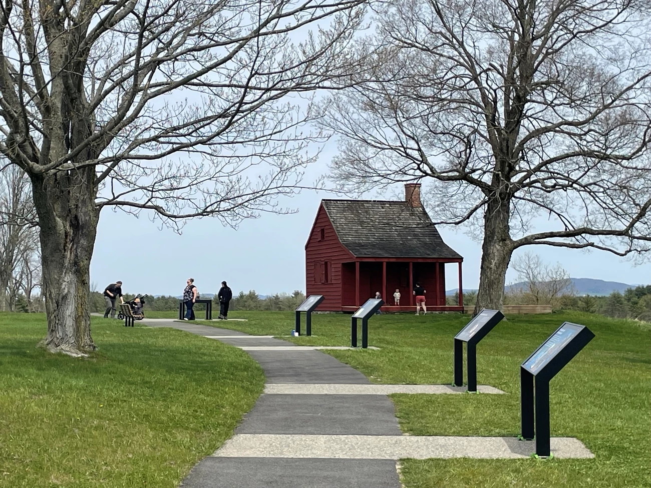 View of Saratoga NHP structure and waysides from accessible walkway.