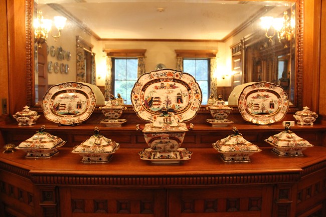 In the Mansion’s dining room is a display of Mason’s Ironstone serving dishes displayed on a side table.