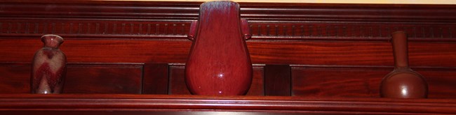 Three Sang de Boef vases on the mantelpiece in the Mansion Prayer Room.