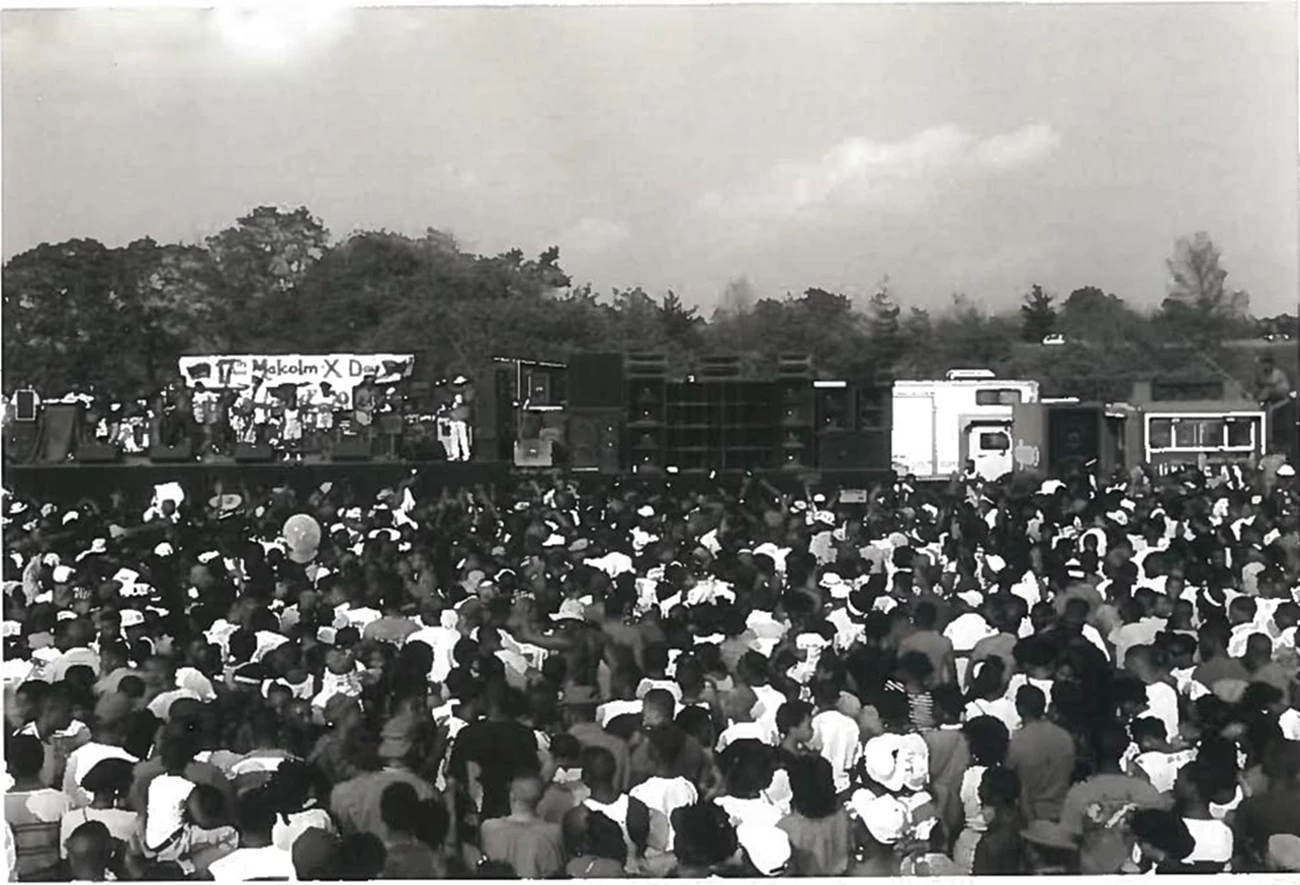 Many people gather around the stage at Malcolm X Day