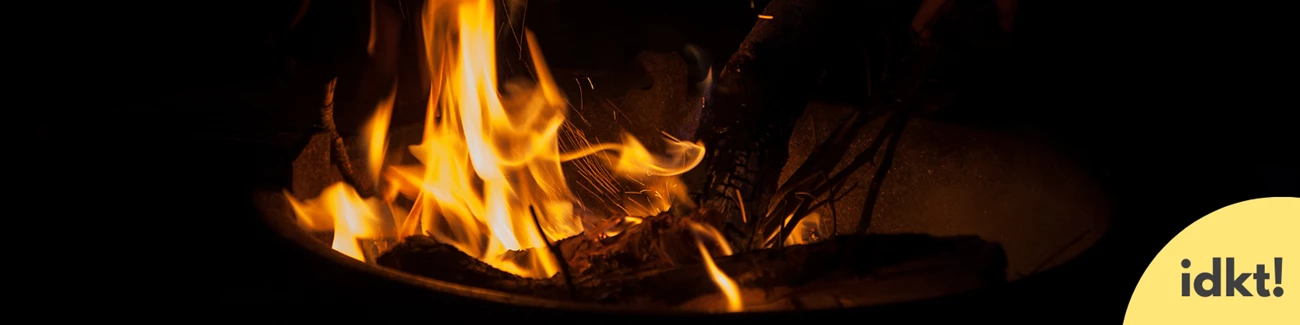 a campfire glows at night