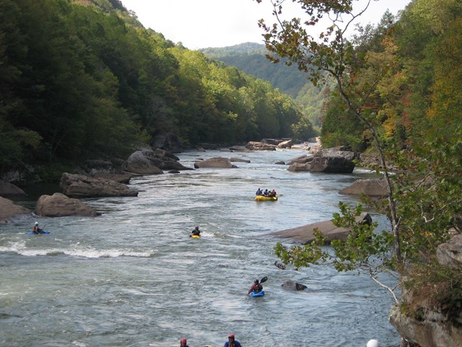 Kayakers floating down the Gauley River.