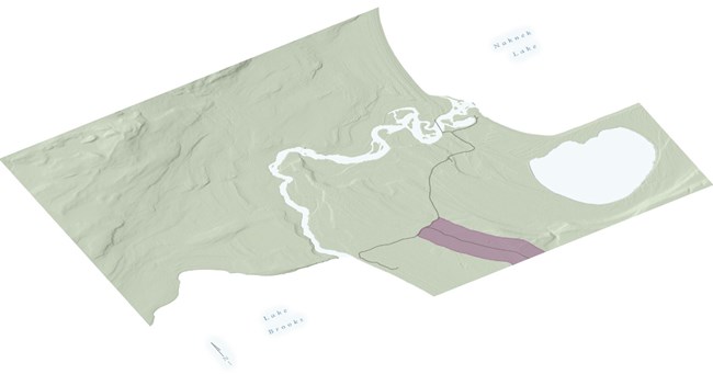 A rectangular landscape along a road is shaded in dark pink