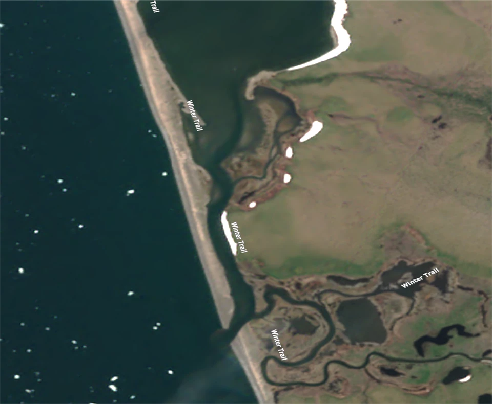 Kotlik Lagoon in June, open to the sea, with sea ice offshore