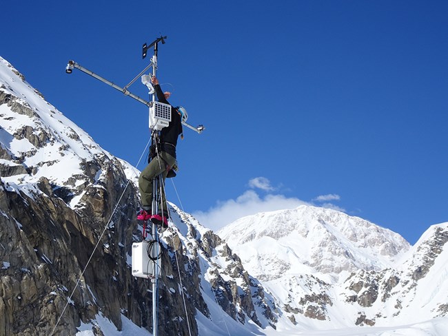 A man on a weather station.