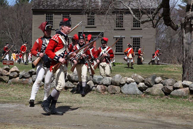 British Redcoats outside the Whittemore House on the Battle Road Battlefield, Minute Man National Historical Park.